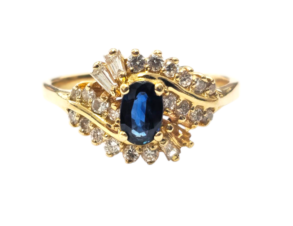 Natural blue sapphire and diamond ring in 14k gold featuring a stunning blue gemstone and sparkling diamonds, elegant jewelry piece.