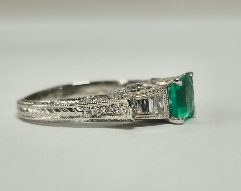 Colombian emerald and diamond cocktail ring by Prince The Jeweler featuring a 1.50 carat central emerald gemstone.
