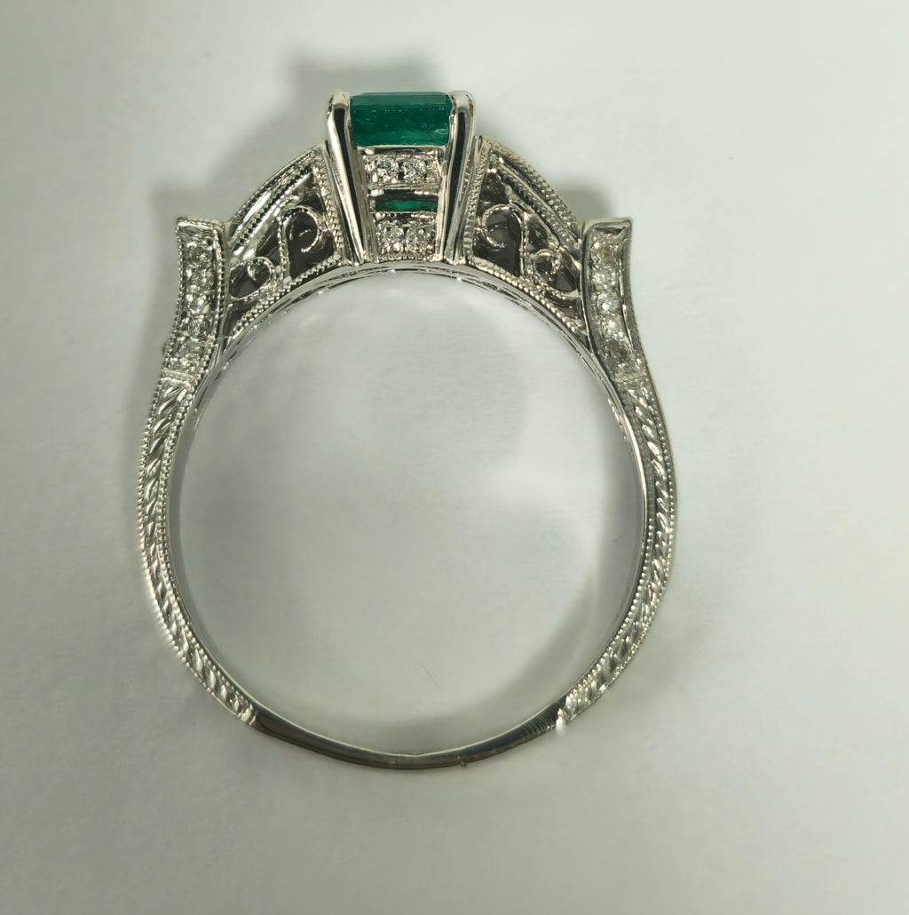 Elegant 1.50 carat Colombian emerald diamond cocktail ring by Prince The Jeweler with a gold band and sparkling gemstone accents.