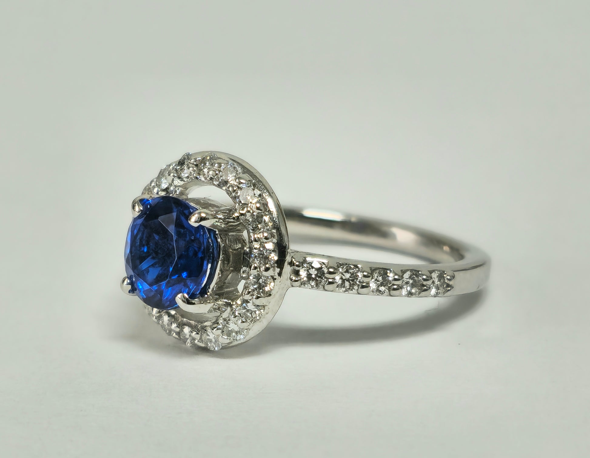 Vintage blue sapphire and diamond ring for women, showcasing intricate design and sparkling gemstones, by Prince The Jeweler.