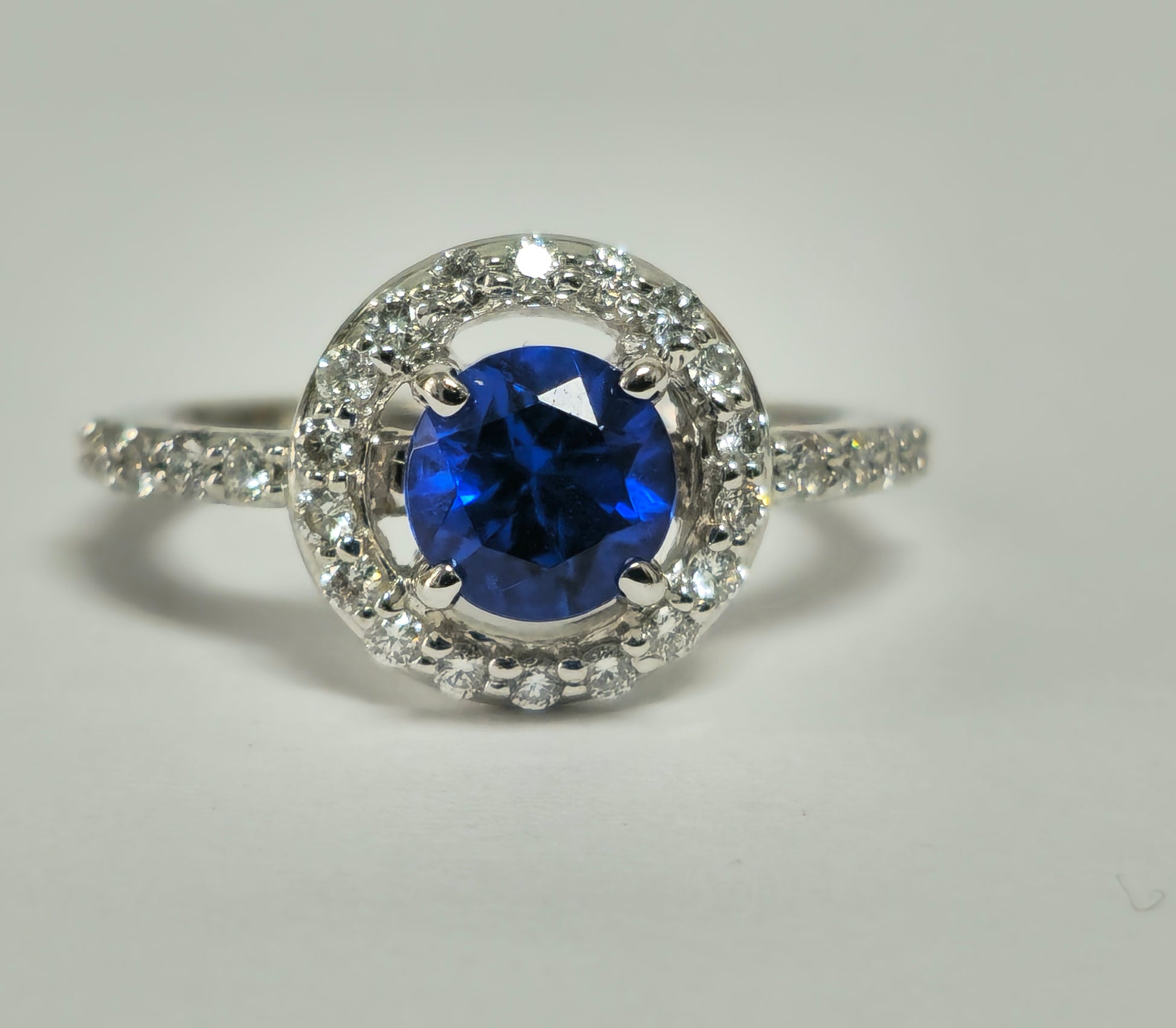 Vintage blue sapphire and diamond ring for women, featuring intricate design, by Prince The Jeweler.
