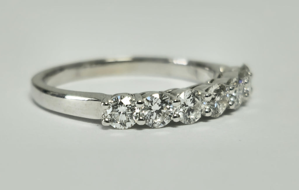 18k gold VVS diamond engagement ring for her with a sparkling center stone, crafted by Prince The Jeweler.