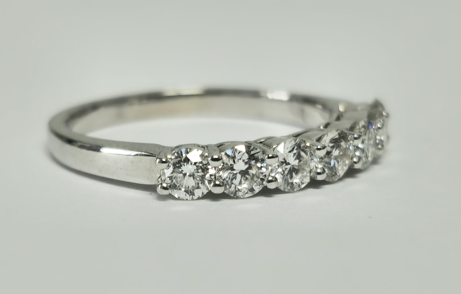 18k gold VVS diamond engagement ring for her with a sparkling center stone, crafted by Prince The Jeweler.