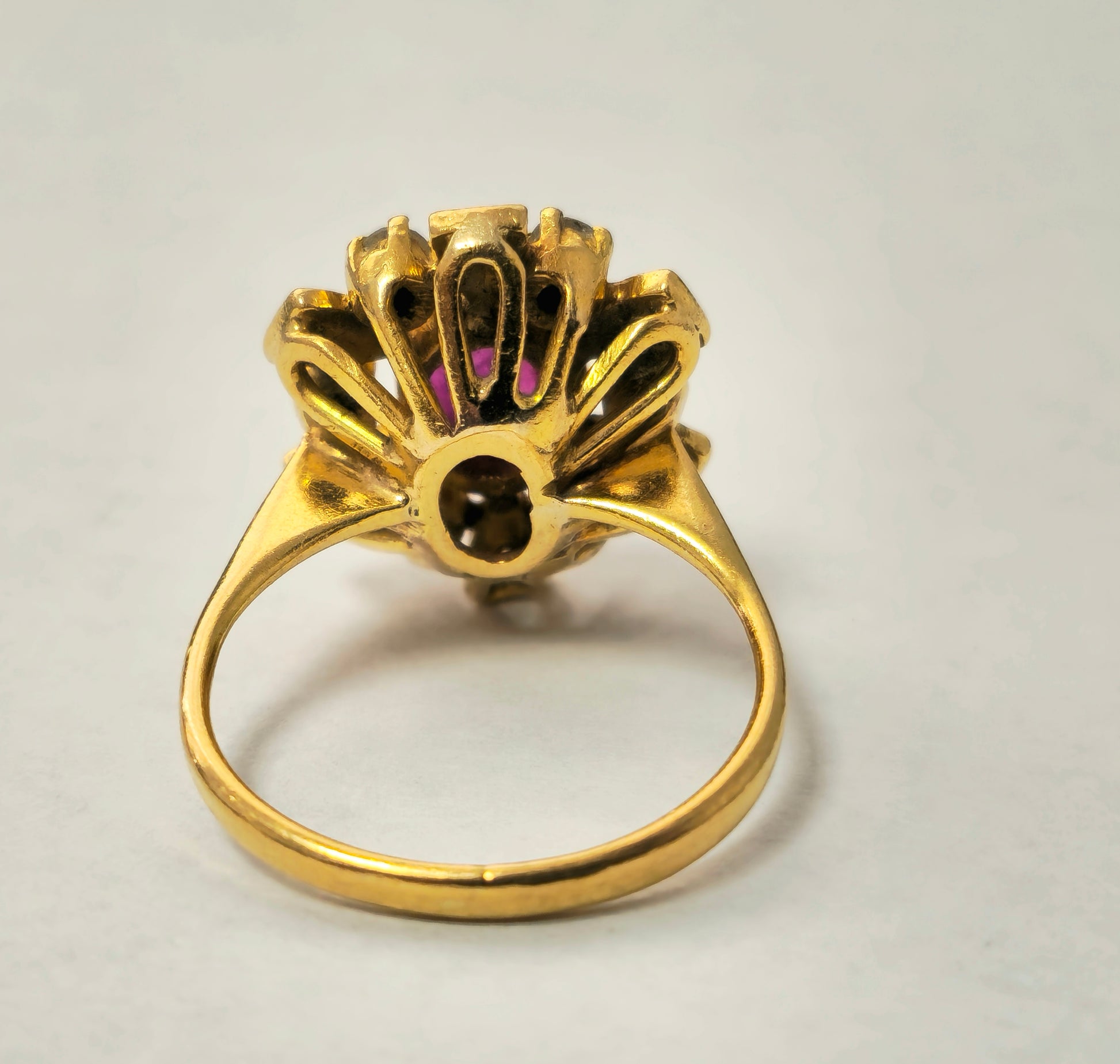 Antique ruby and diamond ring in 18k yellow gold with intricate vintage design, crafted by Prince The Jeweler.