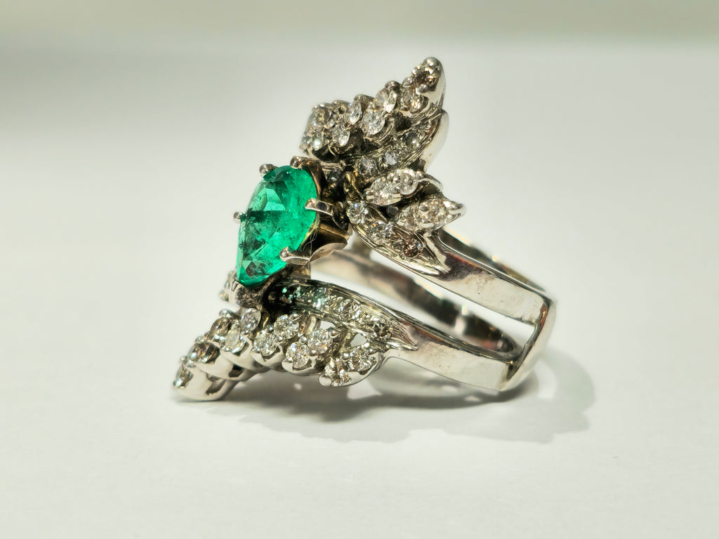 Elegant 5.50 carat Colombian emerald diamond cocktail ring featuring sparkling gemstones set in a luxurious band.