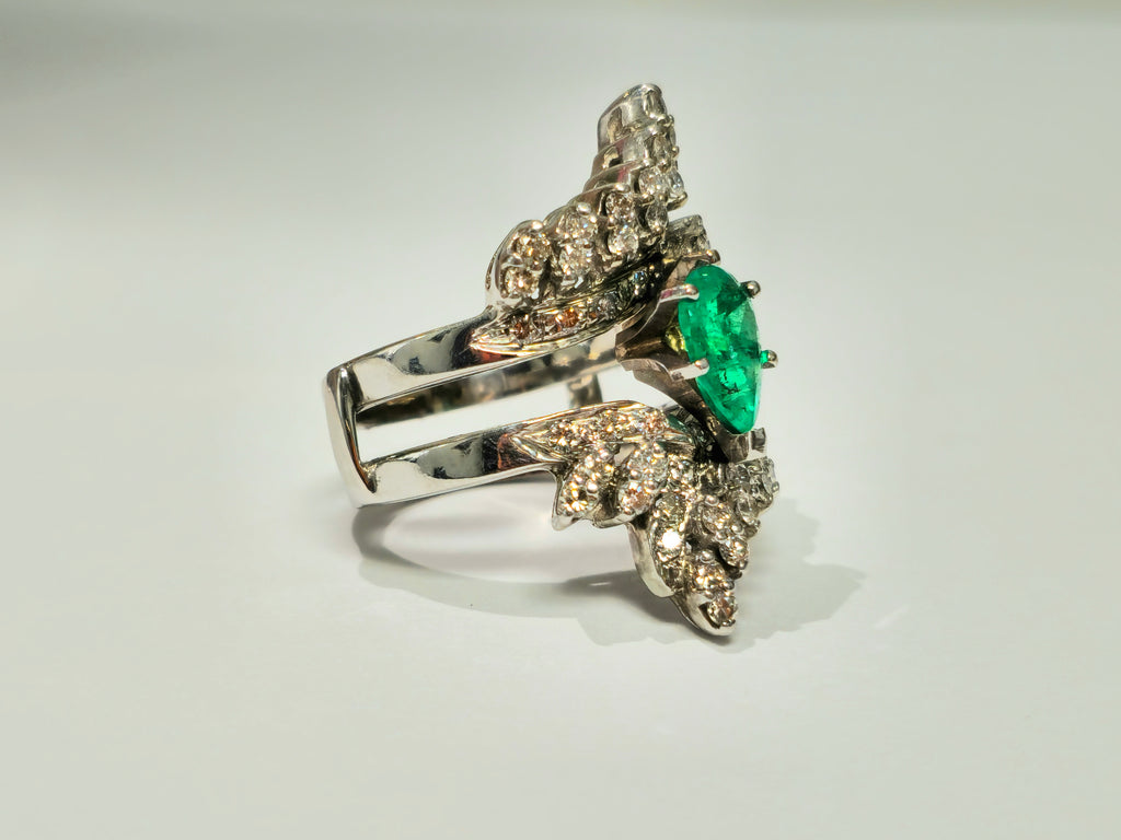 Elegant 5.50 carat Colombian emerald diamond cocktail ring by Prince The Jeweler, featuring vibrant green emeralds and sparkling diamonds.