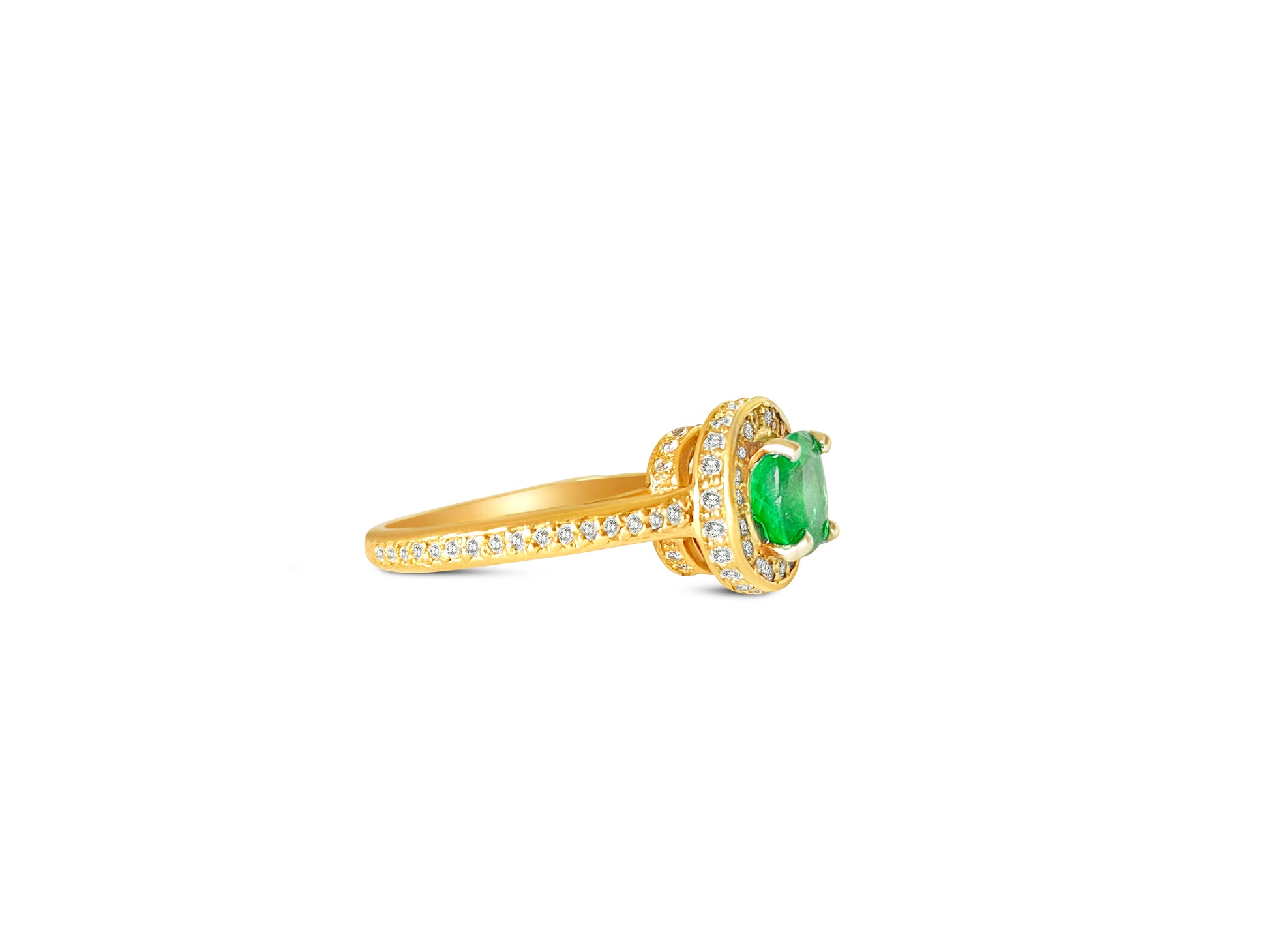 14k gold Colombian emerald and diamond engagement ring with intricate setting and sparkling gemstones.