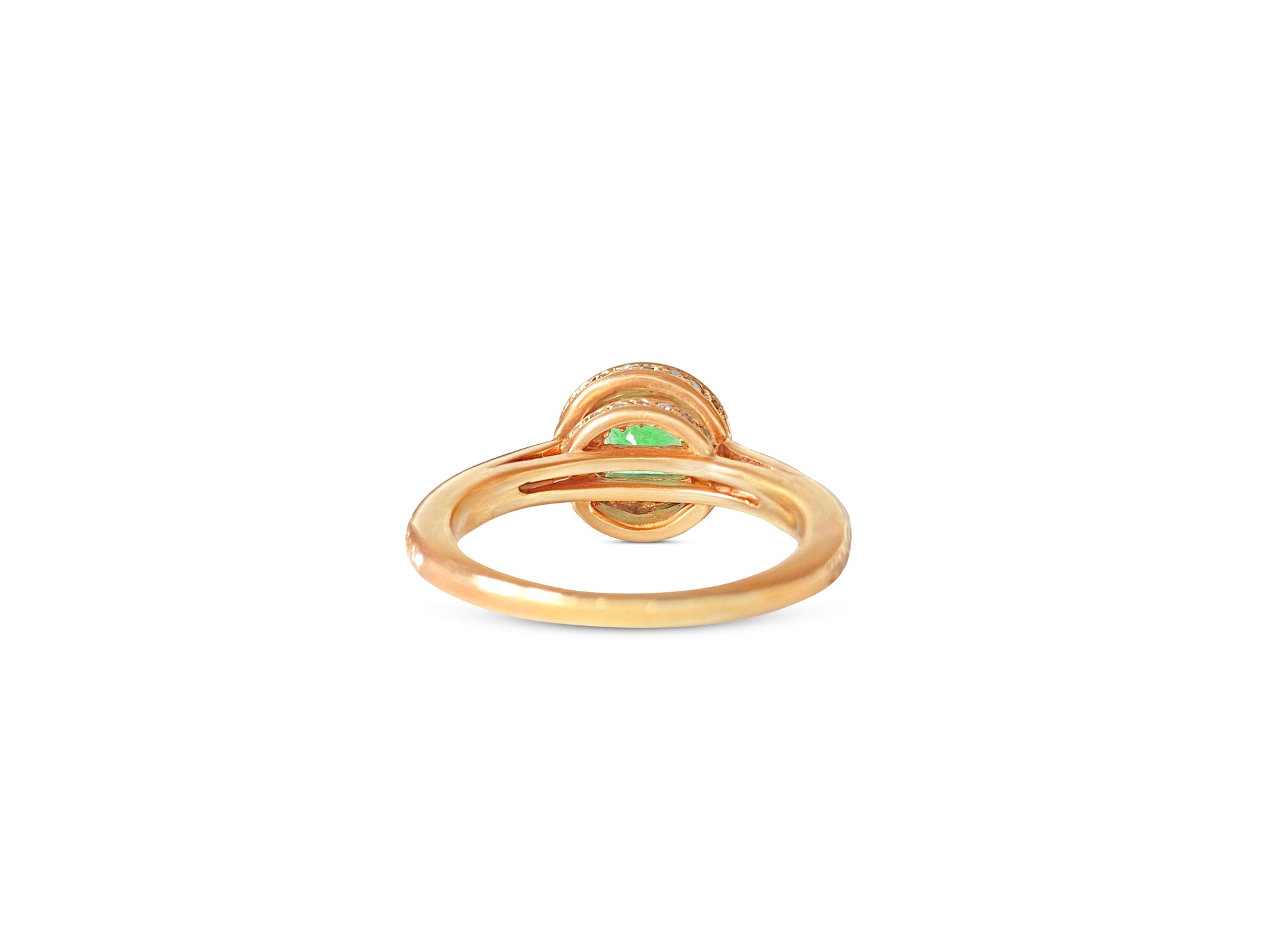 14k gold Colombian emerald and diamond engagement ring with intricate design, featuring a central emerald surrounded by sparkling diamonds.