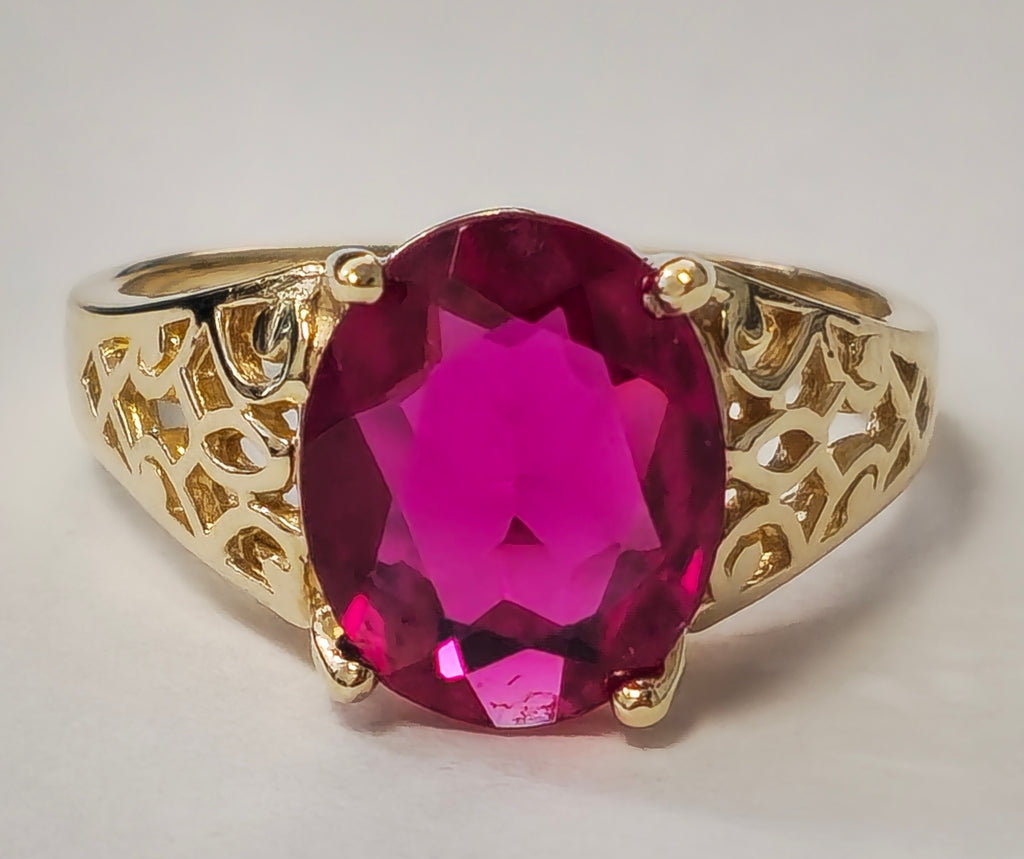 Vintage AAA ruby ring in yellow gold with intricate detailing, featuring a central ruby gemstone and elegant craftsmanship.