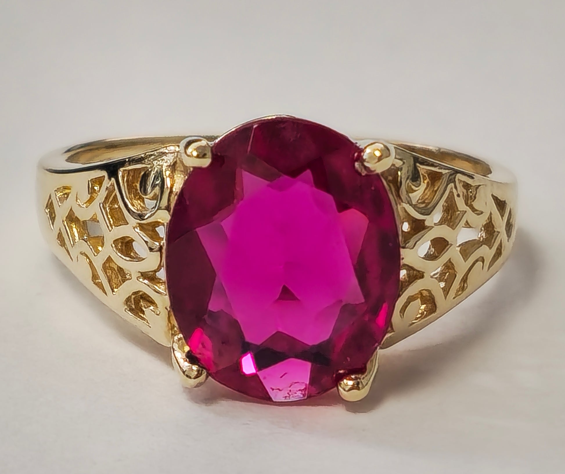 Vintage AAA ruby ring in yellow gold with intricate detailing, featuring a central ruby gemstone and elegant craftsmanship.