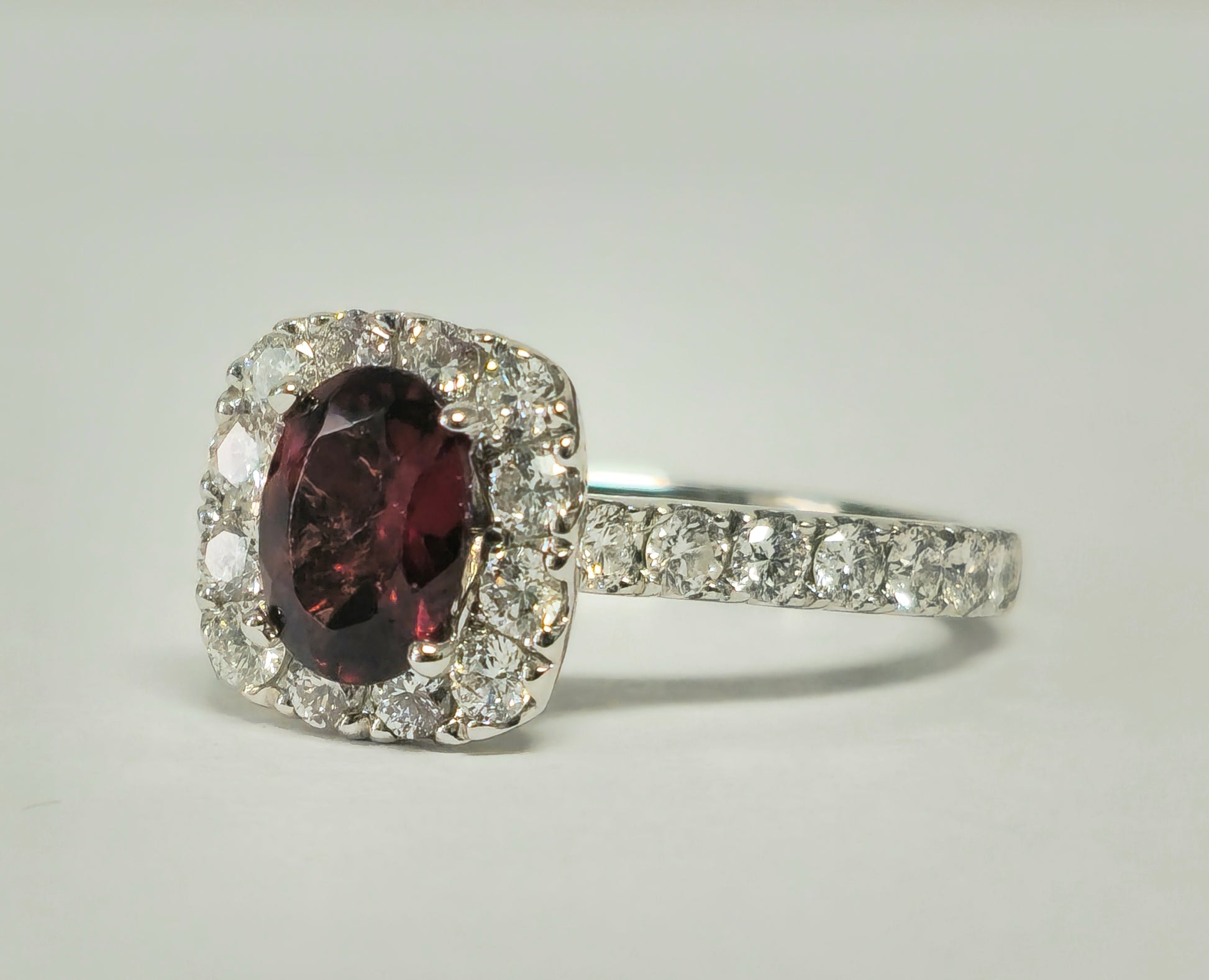 14k gold ladies' ring featuring a 2.40ct garnet and diamond accents, crafted by Prince The Jeweler.