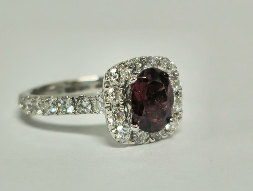 14k gold ladies' ring featuring a 2.40ct garnet gemstone accented with diamonds, crafted by Prince The Jeweler.