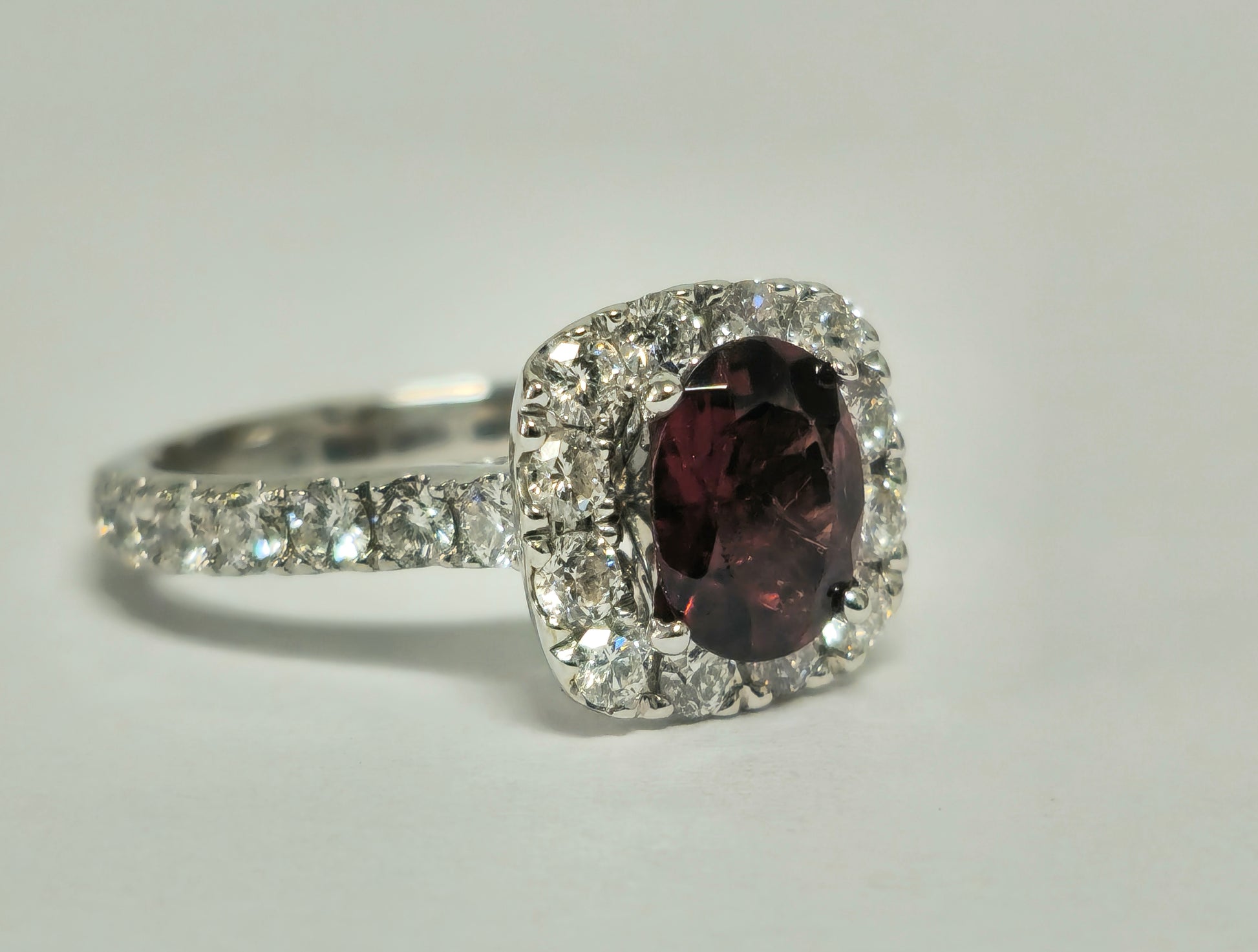 14k gold ladies' ring featuring a 2.40ct garnet gemstone accented with diamonds, crafted by Prince The Jeweler.