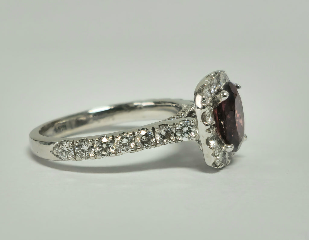14k gold ladies ring featuring a 2.40ct garnet center stone with diamond accents, elegant jewelry by Prince The Jeweler