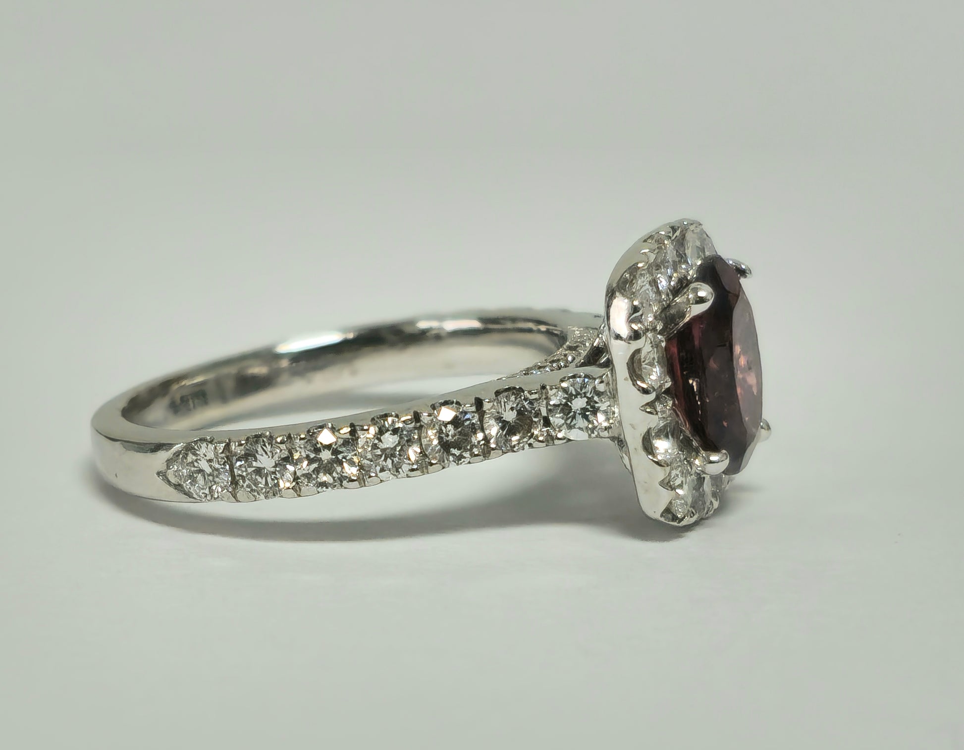 14k gold ladies ring featuring a 2.40ct garnet center stone with diamond accents, elegant jewelry by Prince The Jeweler