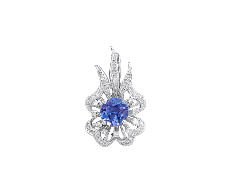 14k gold vintage diamond and tanzanite pin featuring intricate design, crafted by Prince The Jeweler.