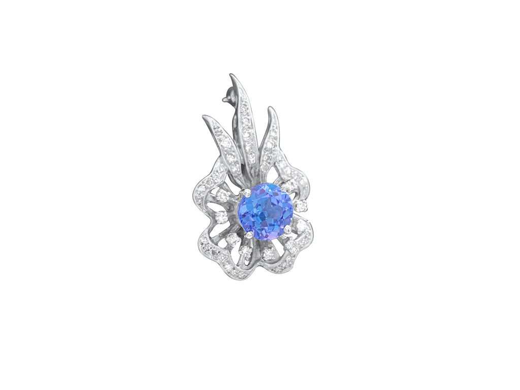 14k gold vintage diamond tanzanite pin with intricate design, featuring sparkling diamonds and a vibrant tanzanite gemstone.