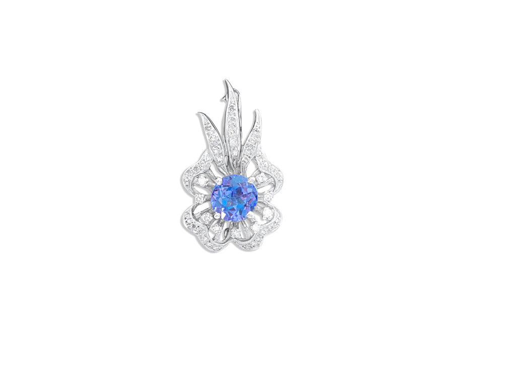 Vintage 14k gold diamond and tanzanite pin with intricate detailing, crafted by Prince The Jeweler.