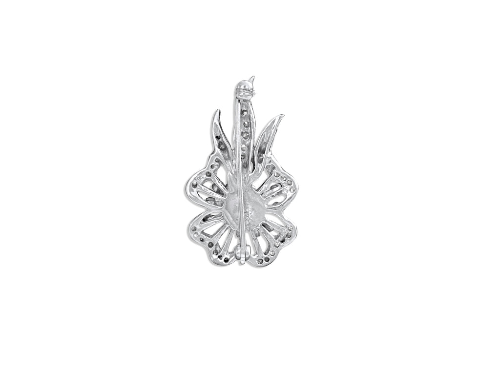 14k gold vintage diamond and tanzanite pin featuring intricate design, crafted by Prince The Jeweler.