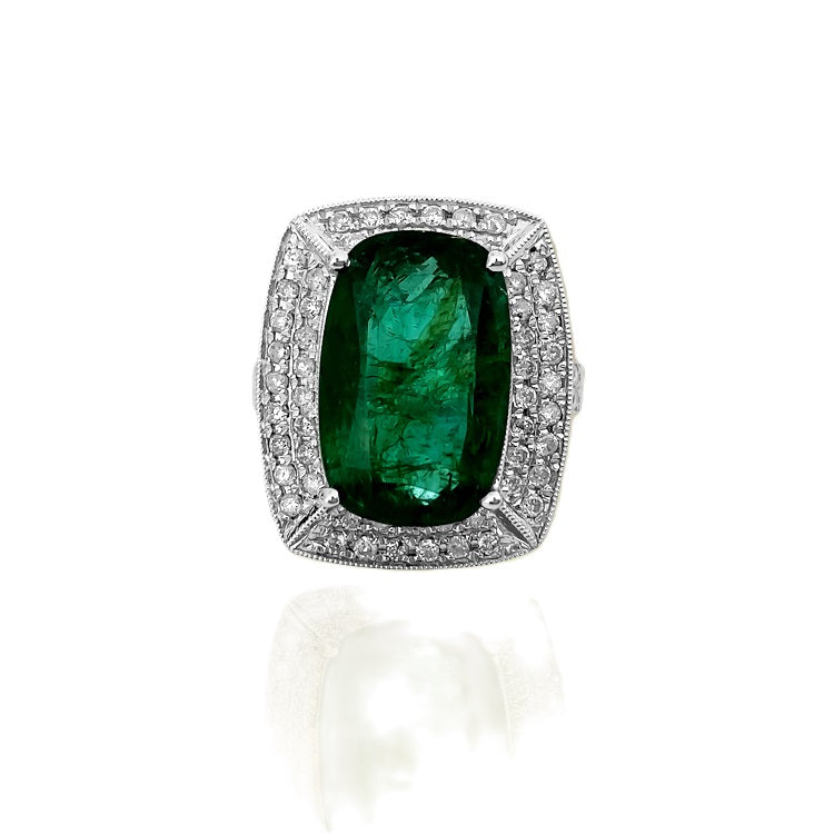 GIA Certified vibrant 7.25 carat emerald and diamond ring featuring a gold band from Prince The Jeweler.