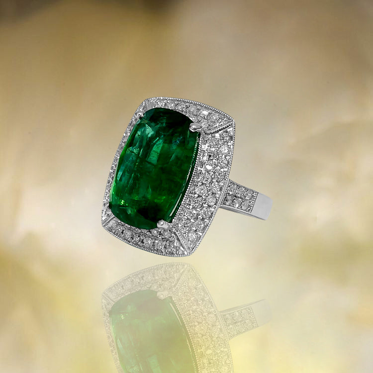 GIA Certified 7.25 Carat emerald and diamond ring by Prince The Jeweler, featuring a vibrant emerald center stone and sparkling diamonds.