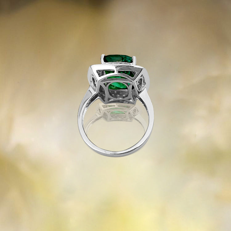 GIA Certified 7.25 Carat emerald and diamond ring featuring vibrant gemstones set in an elegant band by Prince The Jeweler
