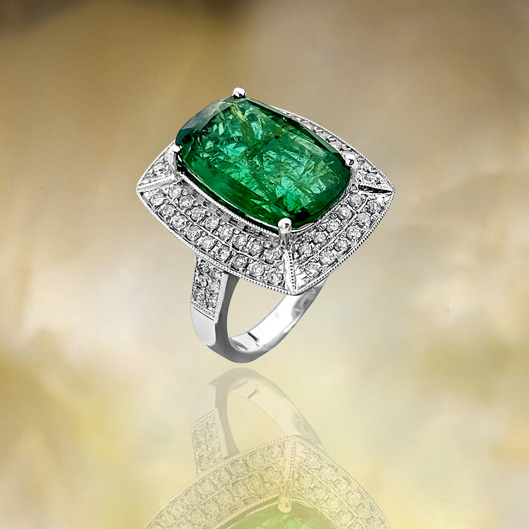 GIA Certified 7.25 Carat emerald and diamond ring by Prince The Jeweler, featuring a vibrant emerald centerpiece surrounded by diamonds.