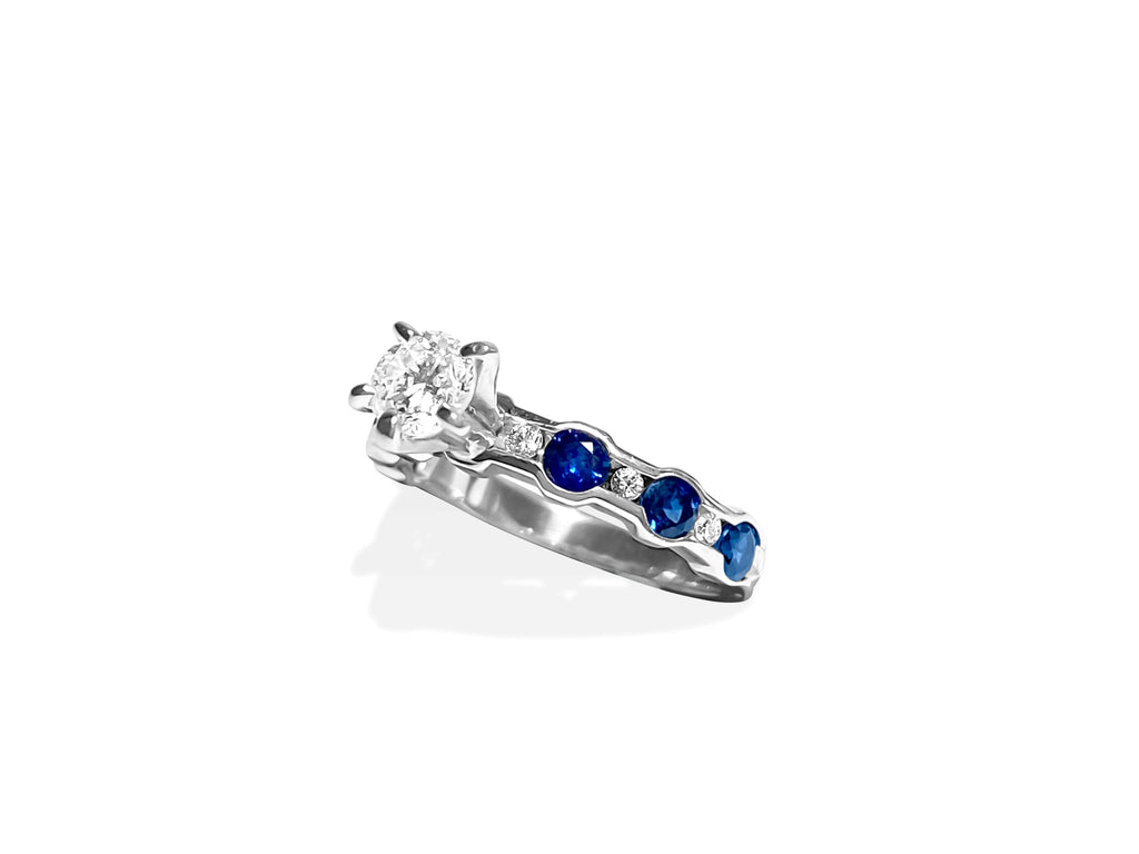 14k gold engagement ring featuring a blue sapphire center stone accented with diamonds, crafted by Prince The Jeweler.