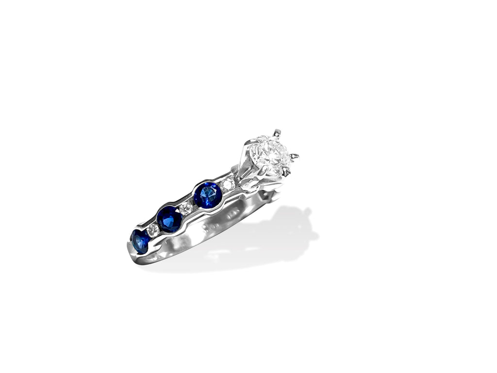 14k gold engagement ring featuring a blue sapphire center stone with diamond accents, crafted by Prince The Jeweler.