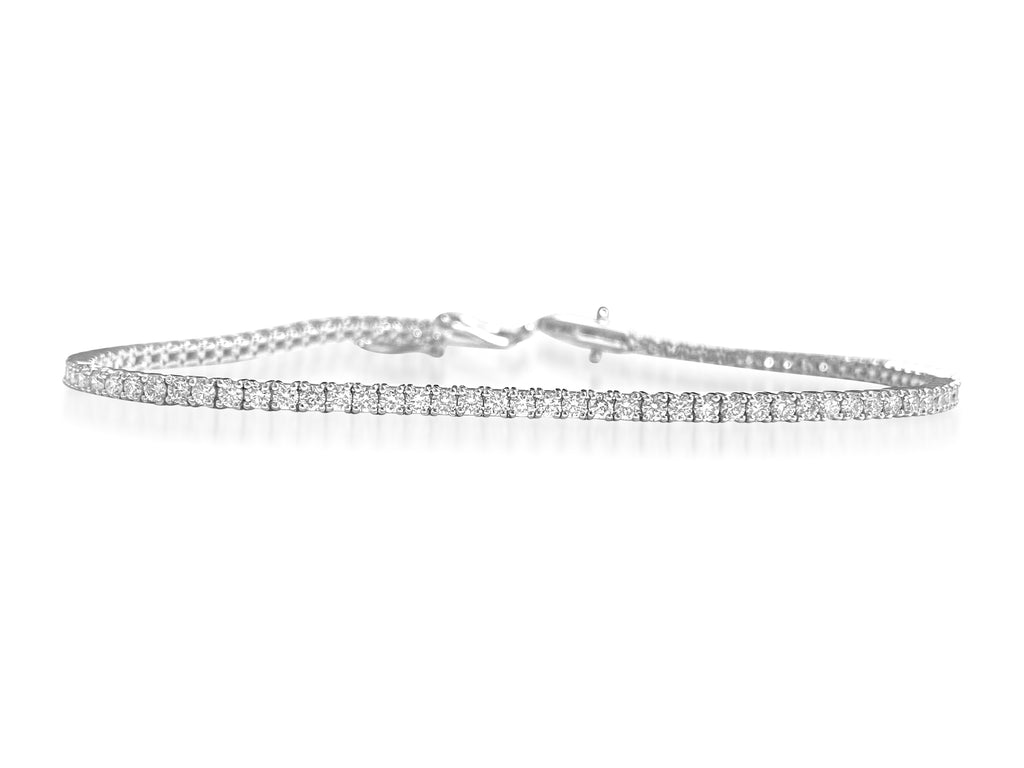 Diamond tennis bracelet for women by Prince The Jeweler featuring 2.50 carats of sparkling VS diamonds on a sleek bracelet design.