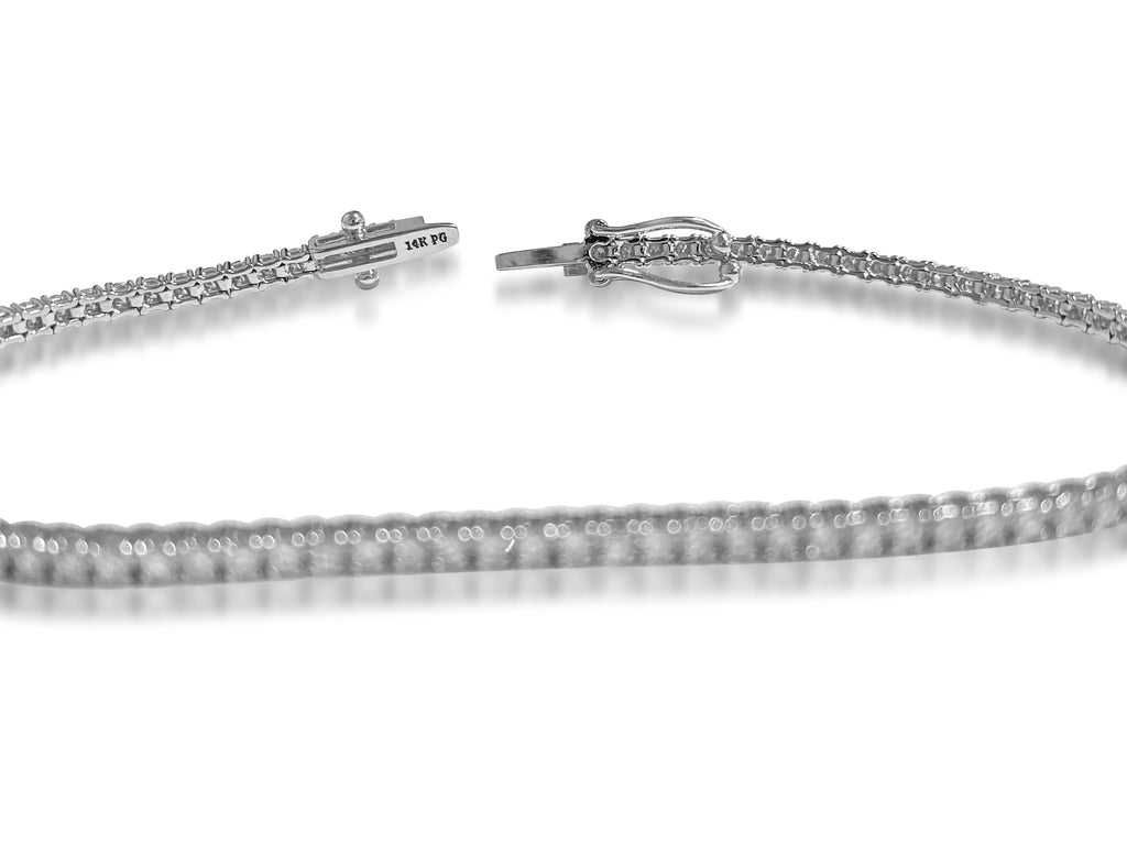 Elegant 2.50 VS diamond tennis bracelet for women by Prince The Jeweler, featuring sparkling diamonds and a delicate bracelet design.