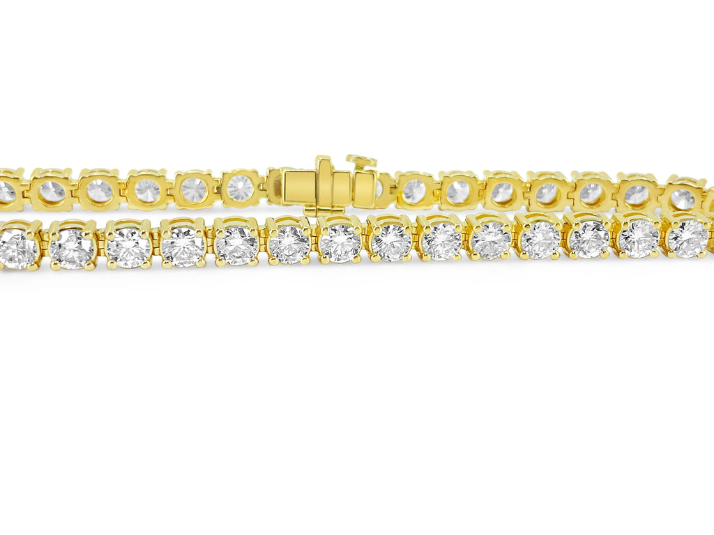 Diamond tennis bracelet in 14k gold with 12.33 carats of sparkling diamonds, featuring a secure clasp design.