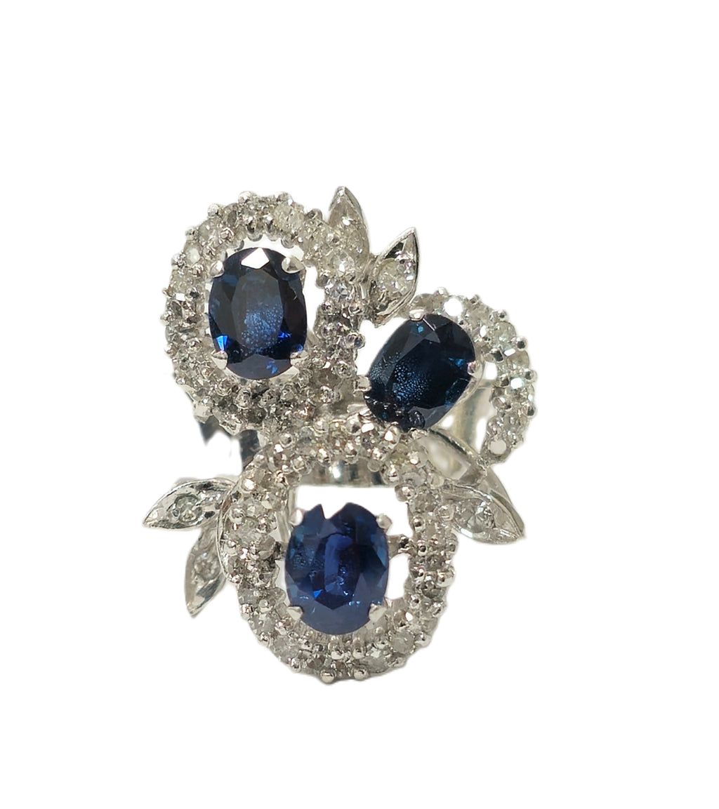 Elegant natural sapphire and diamond ring featuring a 1.25 carat sapphire set in a silver band, crafted by Prince The Jeweler.