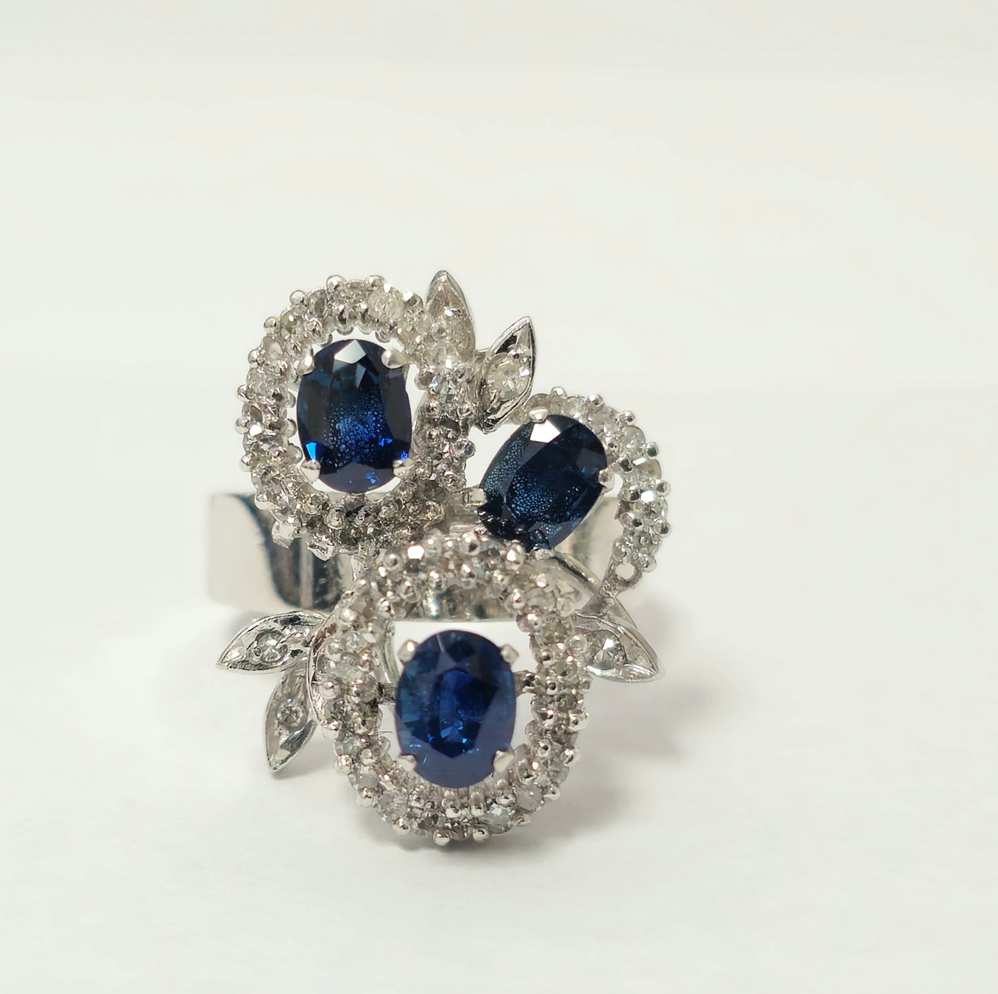 Natural 1.25ct sapphire and diamond ring featuring a gold band, designed by Prince The Jeweler.