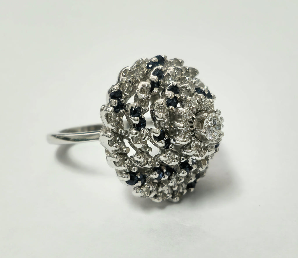 Elegant Prince The Jeweler 3.00 Carat diamond and blue sapphire cocktail ring with intricate setting and sparkling gemstones.