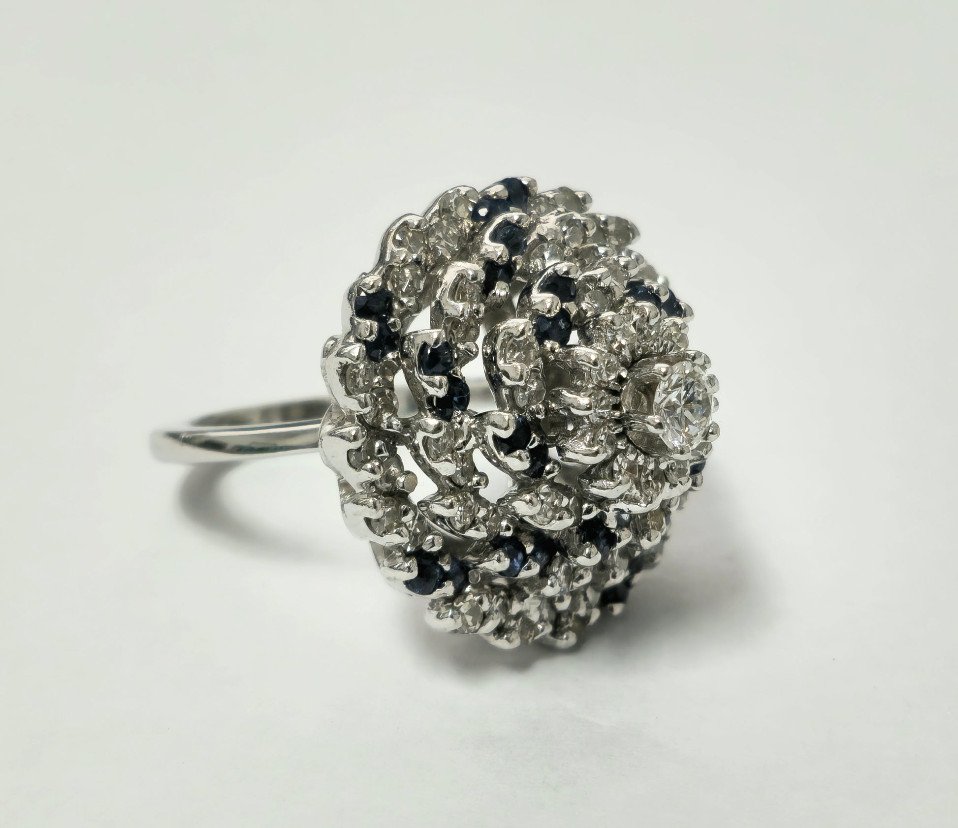 Elegant Prince The Jeweler 3.00 Carat diamond and blue sapphire cocktail ring with intricate setting and sparkling gemstones.