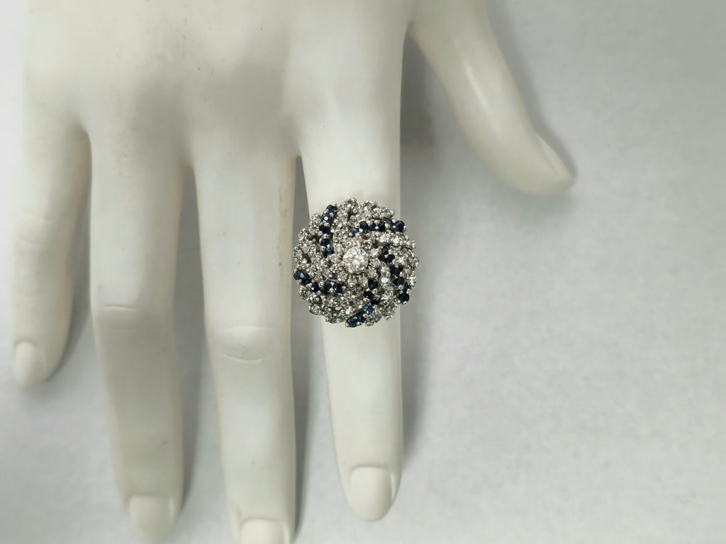 3.00 carat diamond and blue sapphire cocktail ring with intricate band design, featuring sparkling gemstones and a luxurious finish.