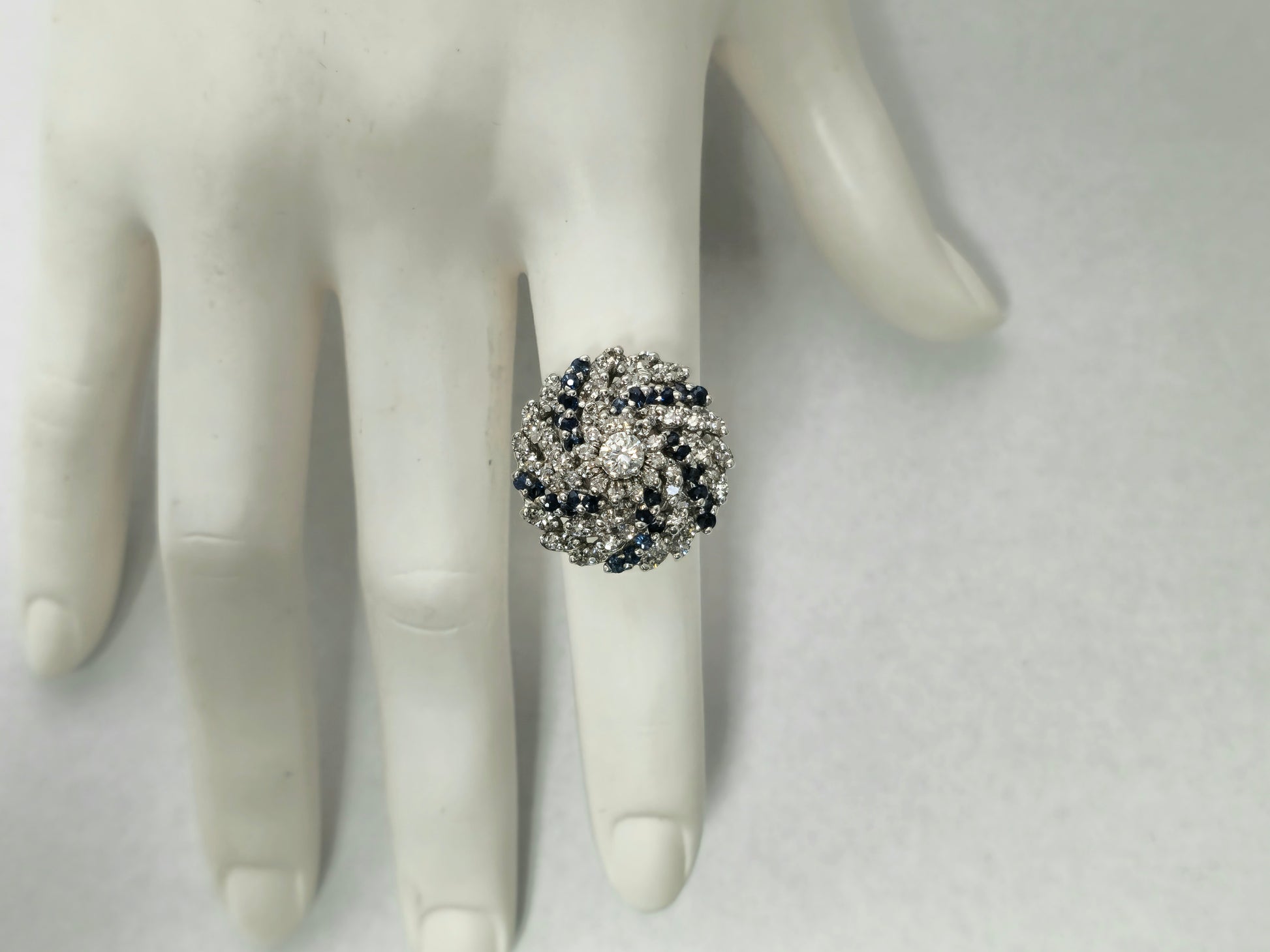 3.00 carat diamond and blue sapphire cocktail ring with intricate band design, featuring sparkling gemstones and a luxurious finish.