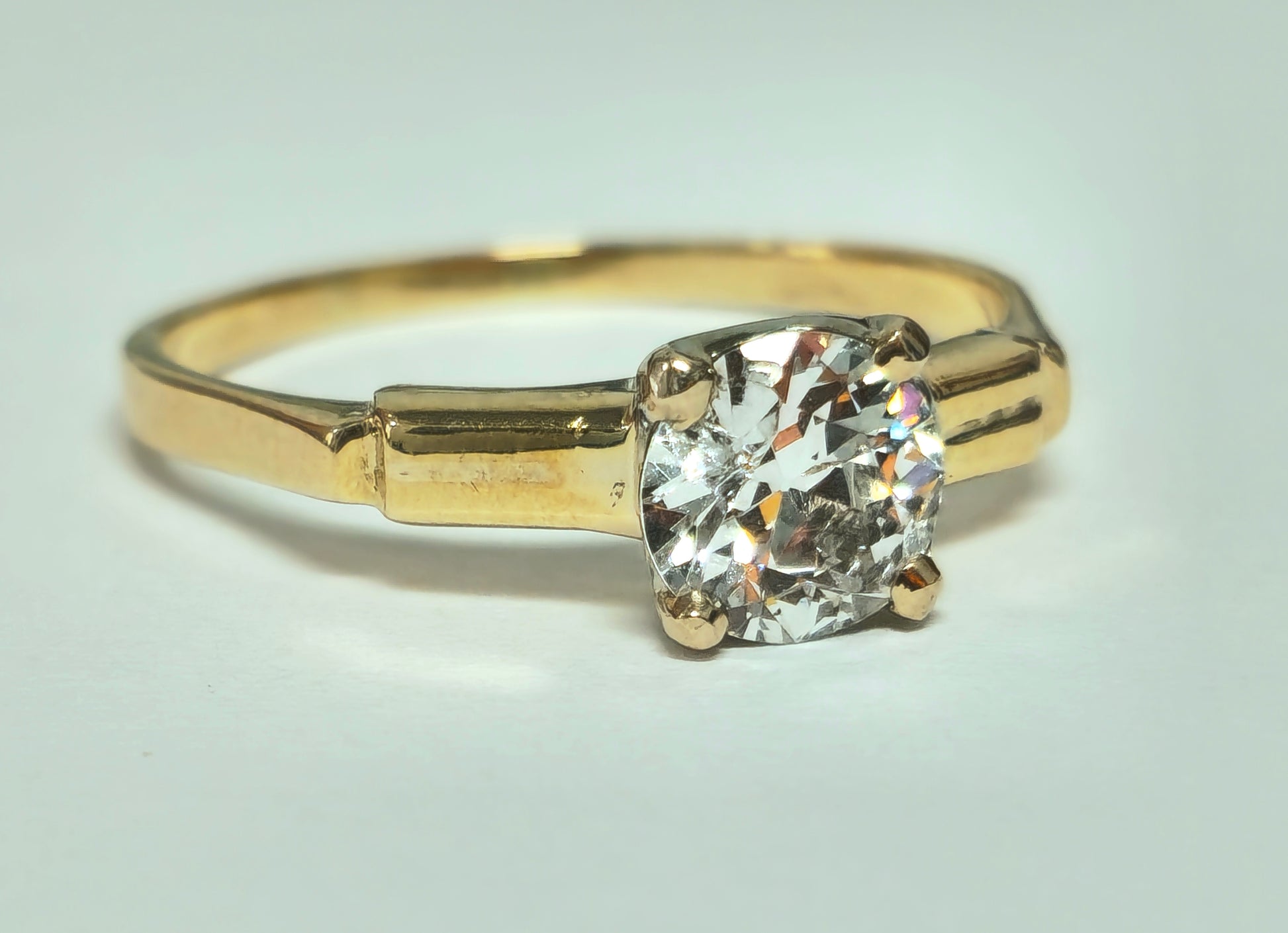 Vintage 1.03 carat solitaire engagement ring by Prince The Jeweler, featuring a sparkling central diamond and elegant band.