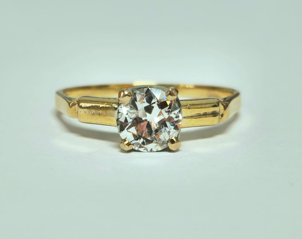 Vintage 1.03 carat solitaire engagement ring from Prince The Jeweler, showcasing a sparkling central diamond and elegant band.