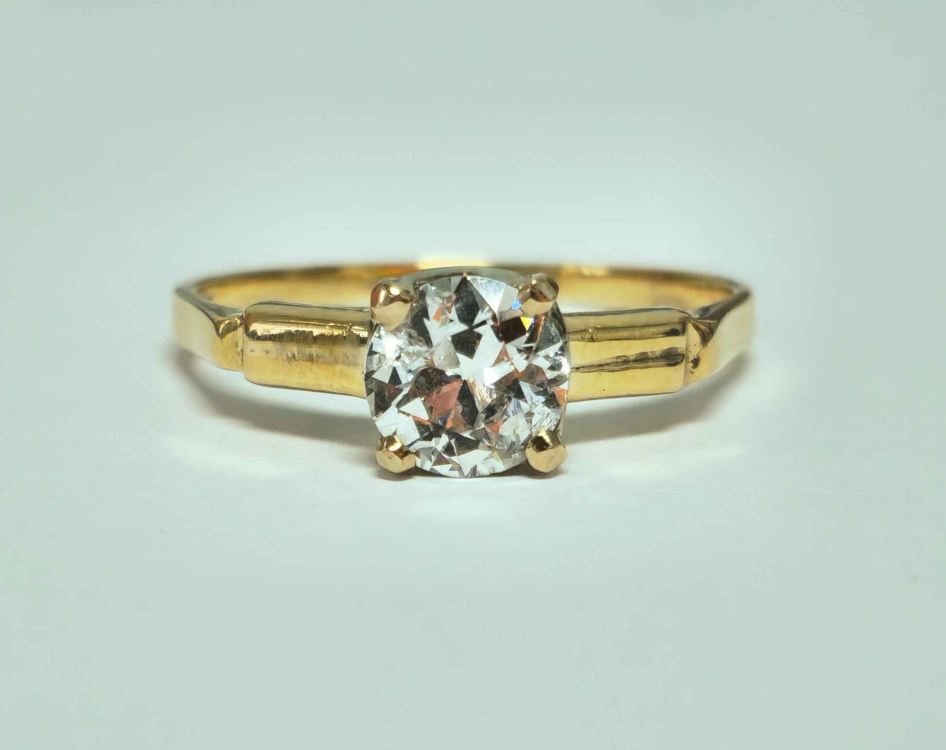 Vintage 1.03 carat solitaire engagement ring from Prince The Jeweler, showcasing a sparkling central diamond and elegant band.