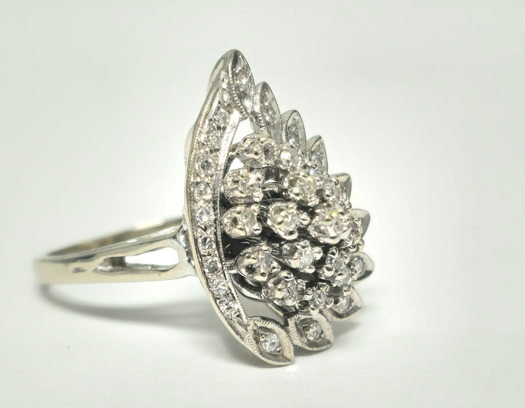 14k white gold engagement ring with wing motif and diamonds, vintage late 20th-century design by Prince The Jeweler.
