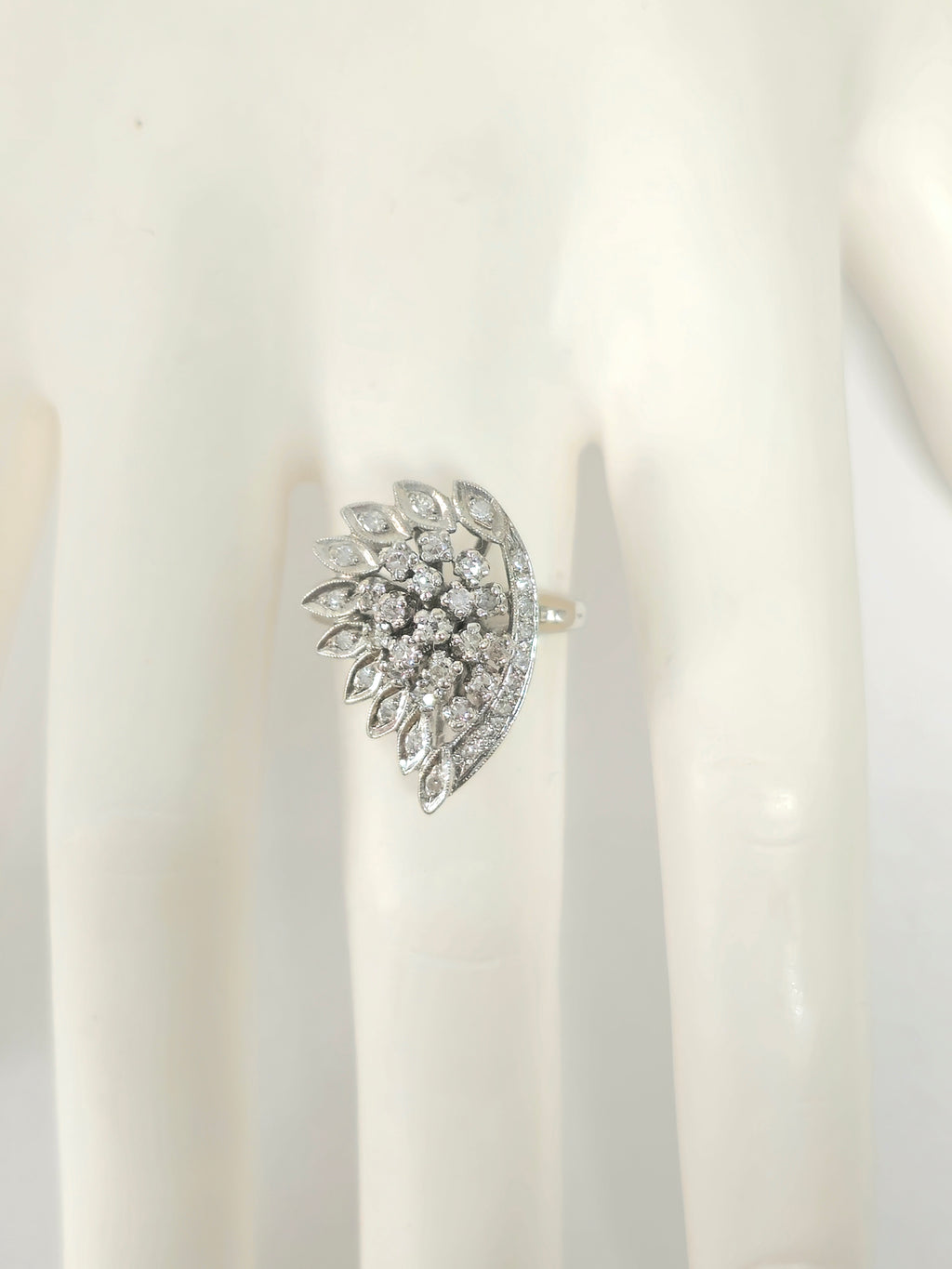 Late 20th century Prince The Jeweler wing motif 14k white gold diamond engagement ring with intricate design and sparkling diamonds.