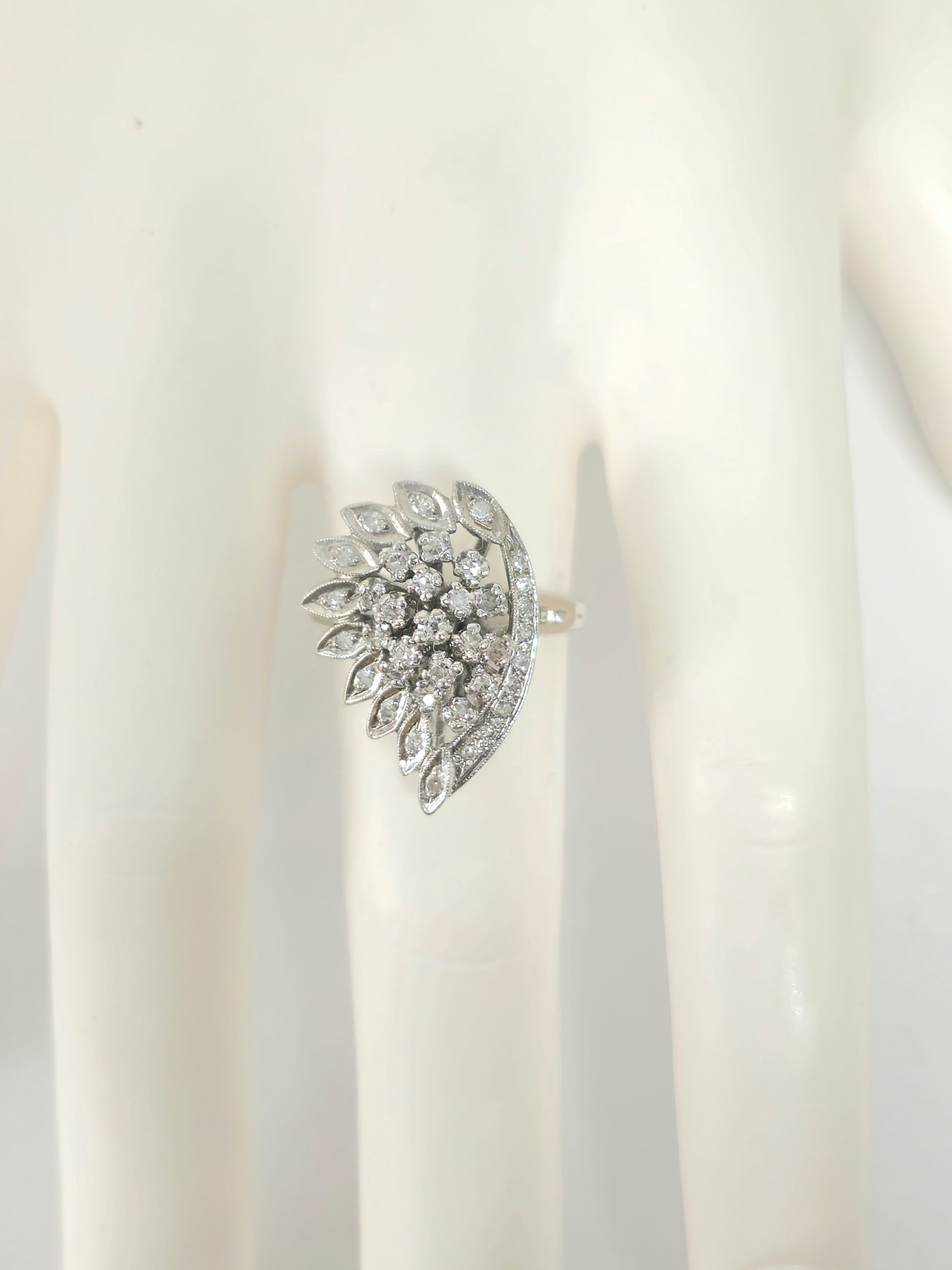 Late 20th century Prince The Jeweler wing motif 14k white gold diamond engagement ring with intricate design and sparkling diamonds.