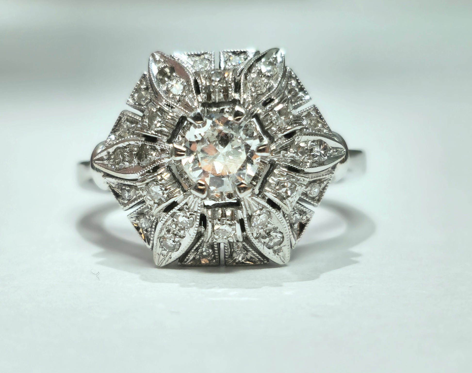 Art Deco 2.00 carat diamond gold ring with intricate design, featuring sparkling diamonds set in polished gold.