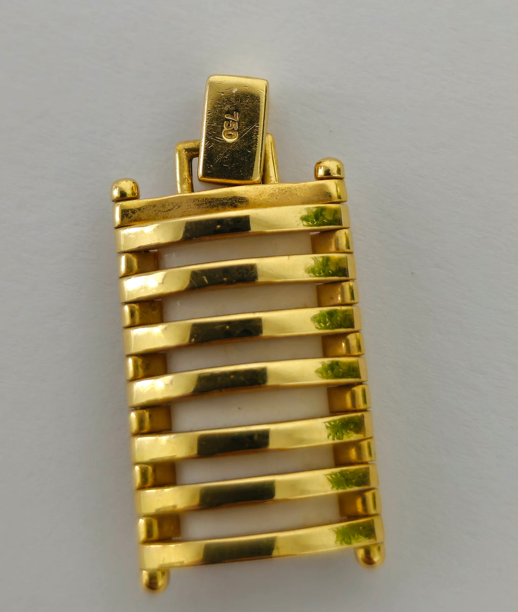 Elegant ivory and diamond pendant in 18k gold, featuring modern design and craftsmanship by Prince The Jeweler.