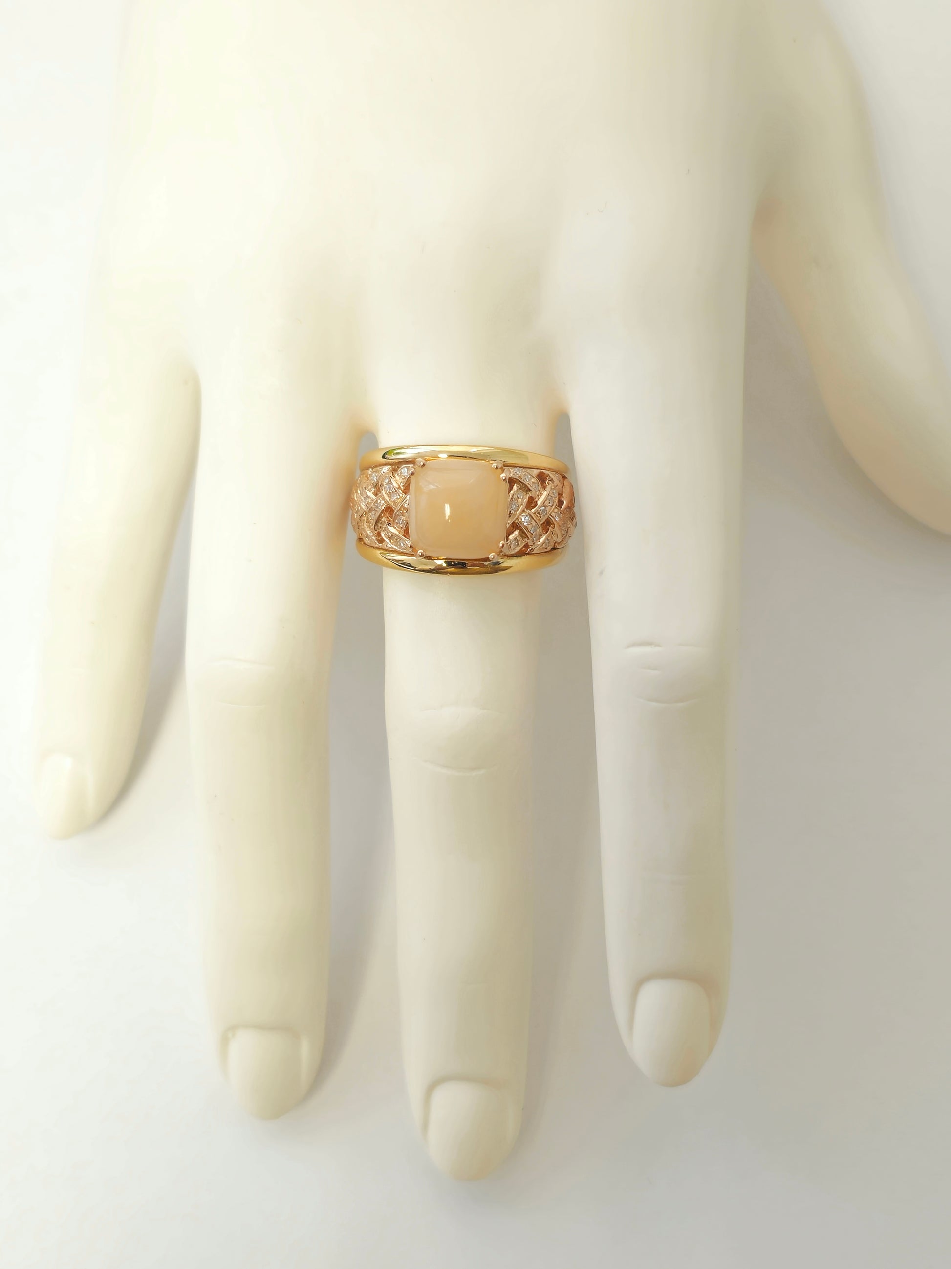Women's modern pink opal and diamond engagement ring by Prince The Jeweler, featuring a 5.70 carat pink opal centerpiece.