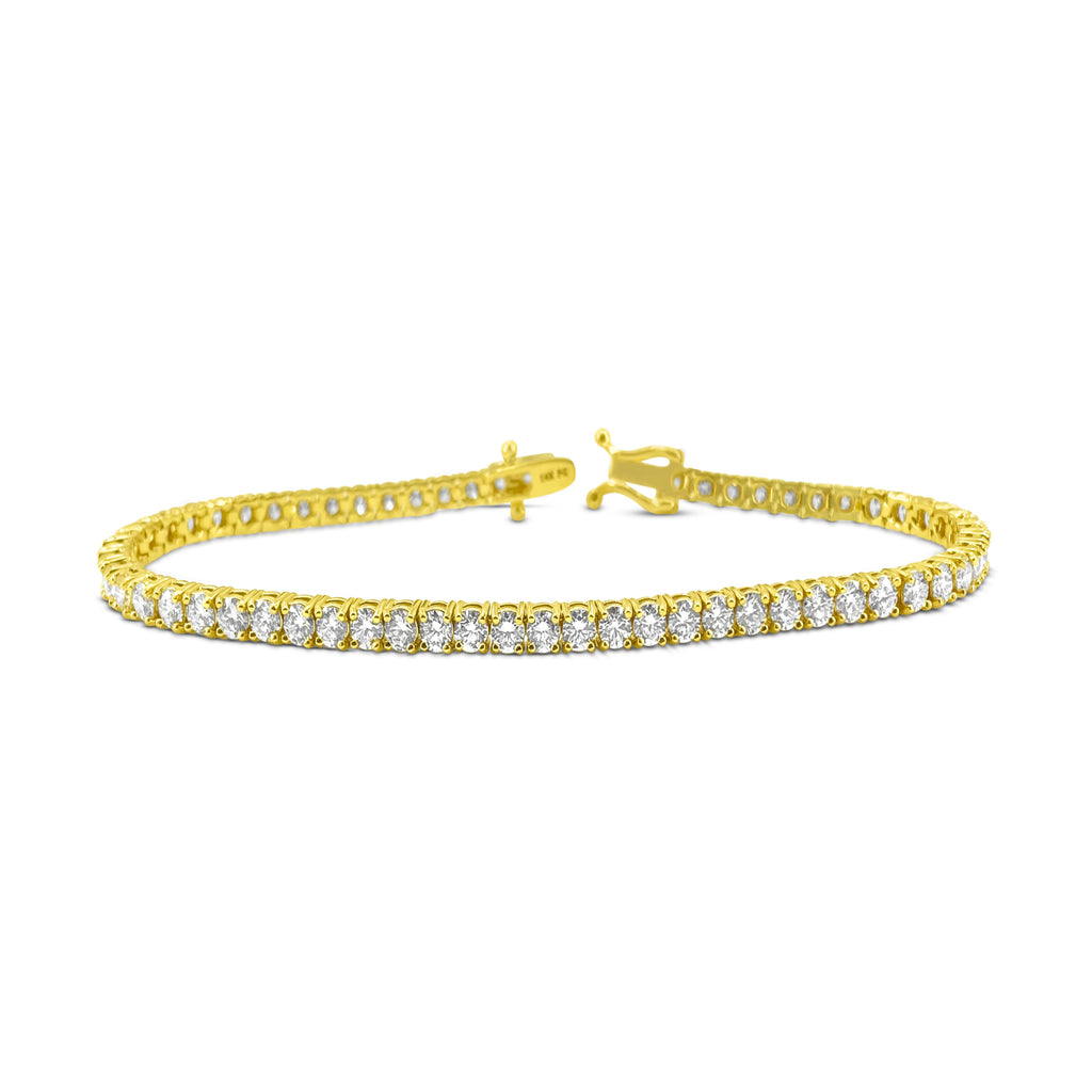14k gold diamond tennis bracelet with 6.25 carats of VVS diamonds, featuring sparkling, high-quality gemstone design.