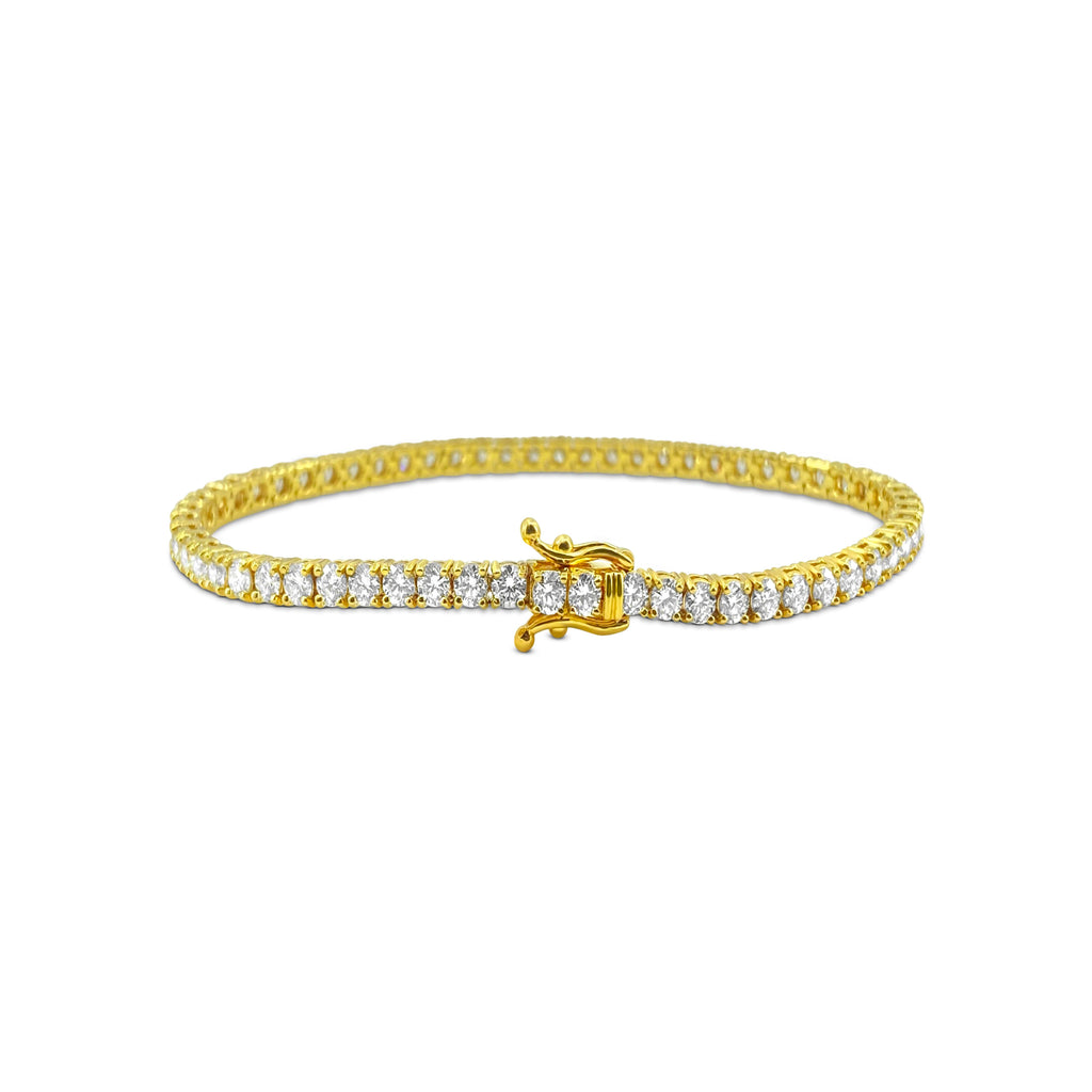 14k gold diamond tennis bracelet with 6.25ct VVS diamonds, showcasing sparkling stones and elegant design.