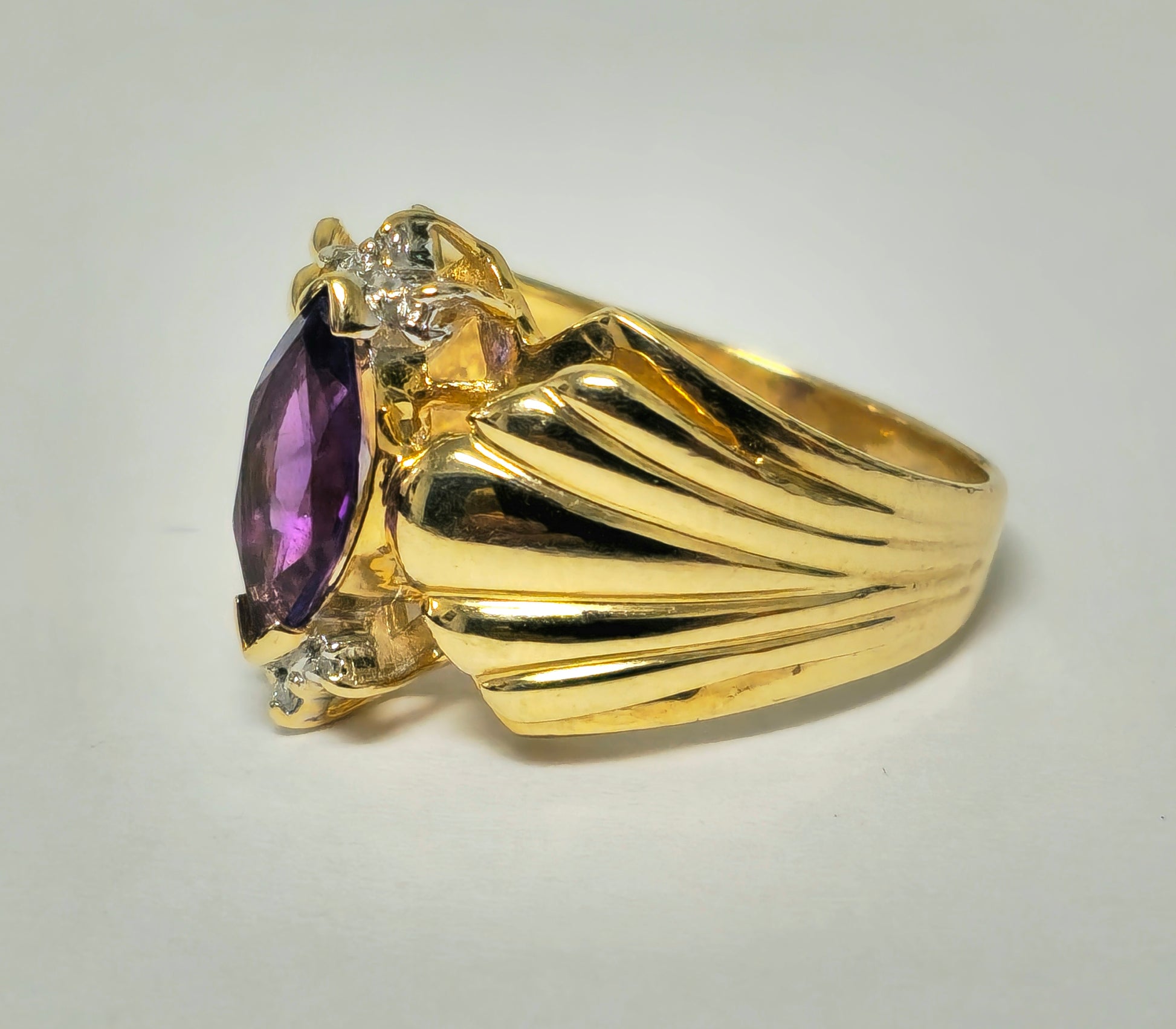 Victorian style 2.30 carat amethyst and diamond cocktail ring in 14k gold with intricate vintage design.